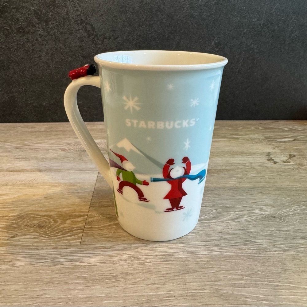 Starbucks 2011 Holiday Christmas Mug Sledding Scene with Airplane on Handle